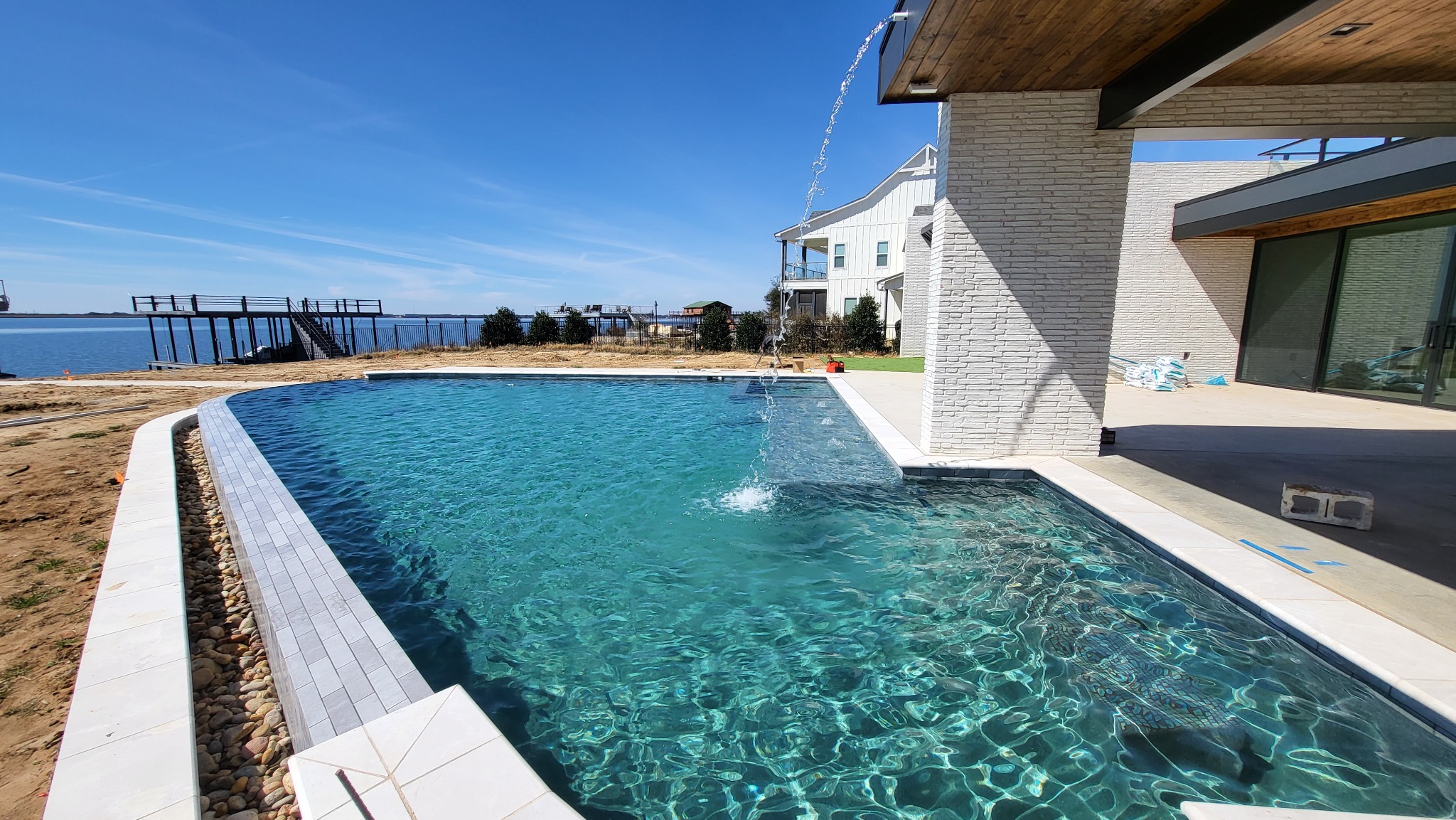 Custom pool and spa overlooking the water