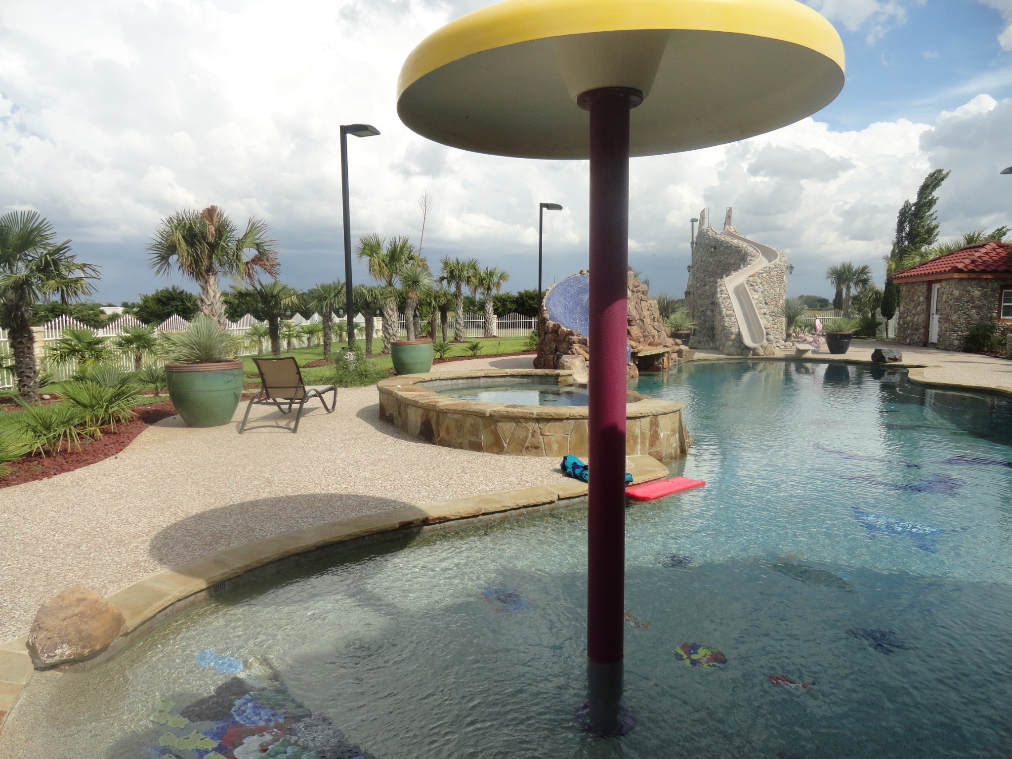 Large custom swimming pool, spa, stonework, and outdoor living by King Pools