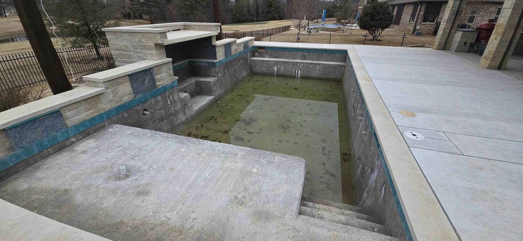 Tile and coping installation in progress