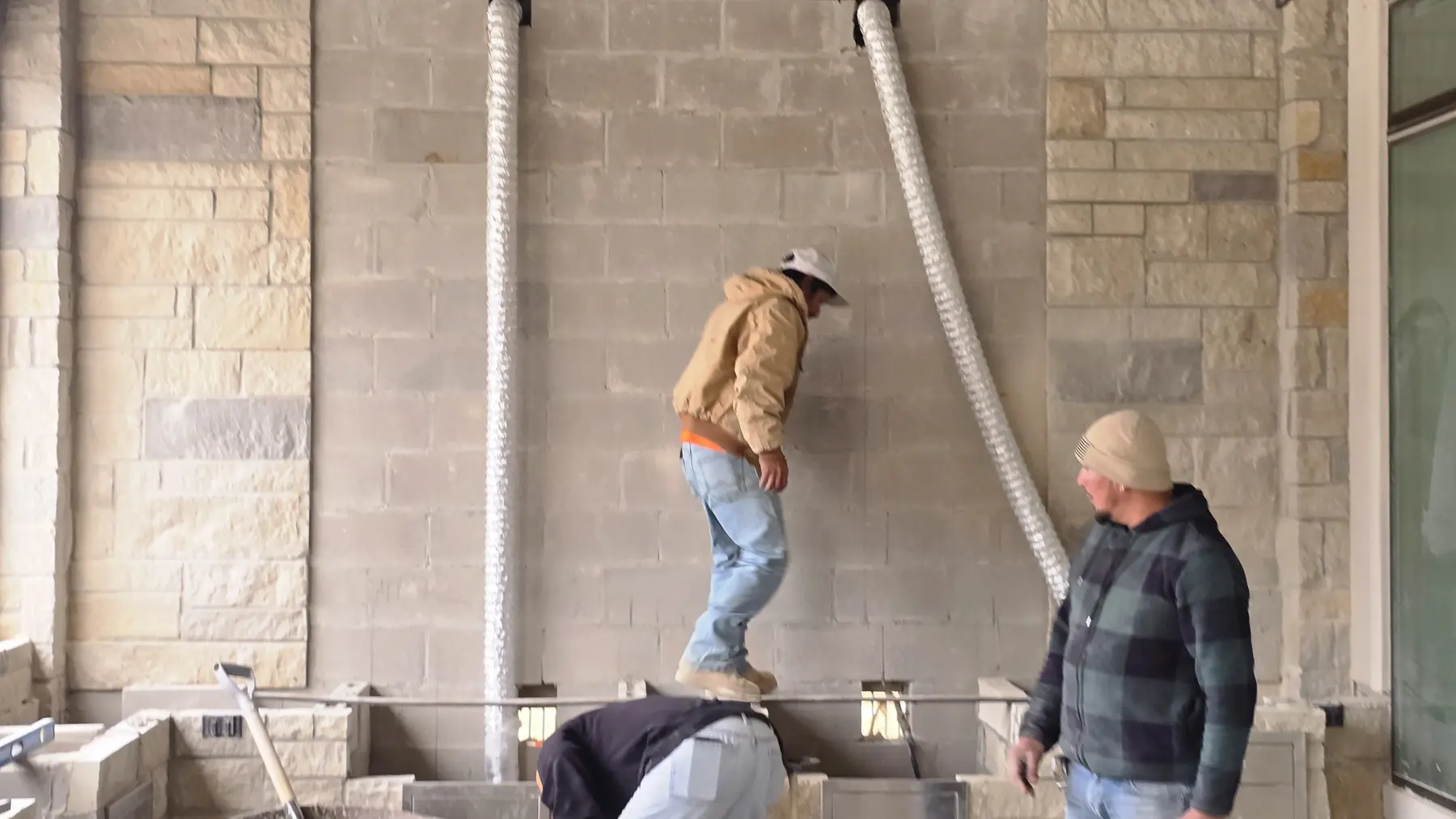 Stone columns and covered structure during construction