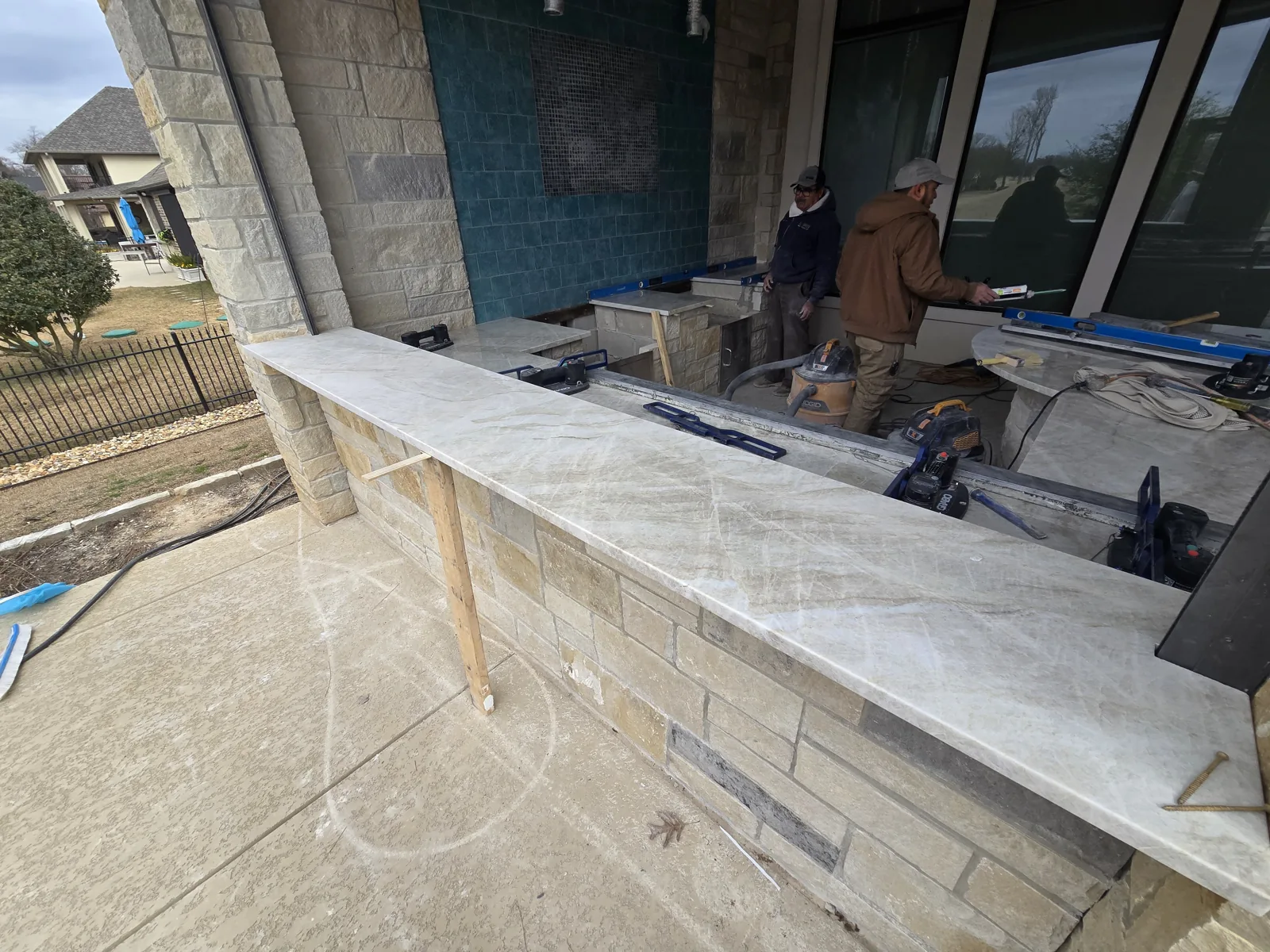 Outdoor-kitchen island and cabinetry installation