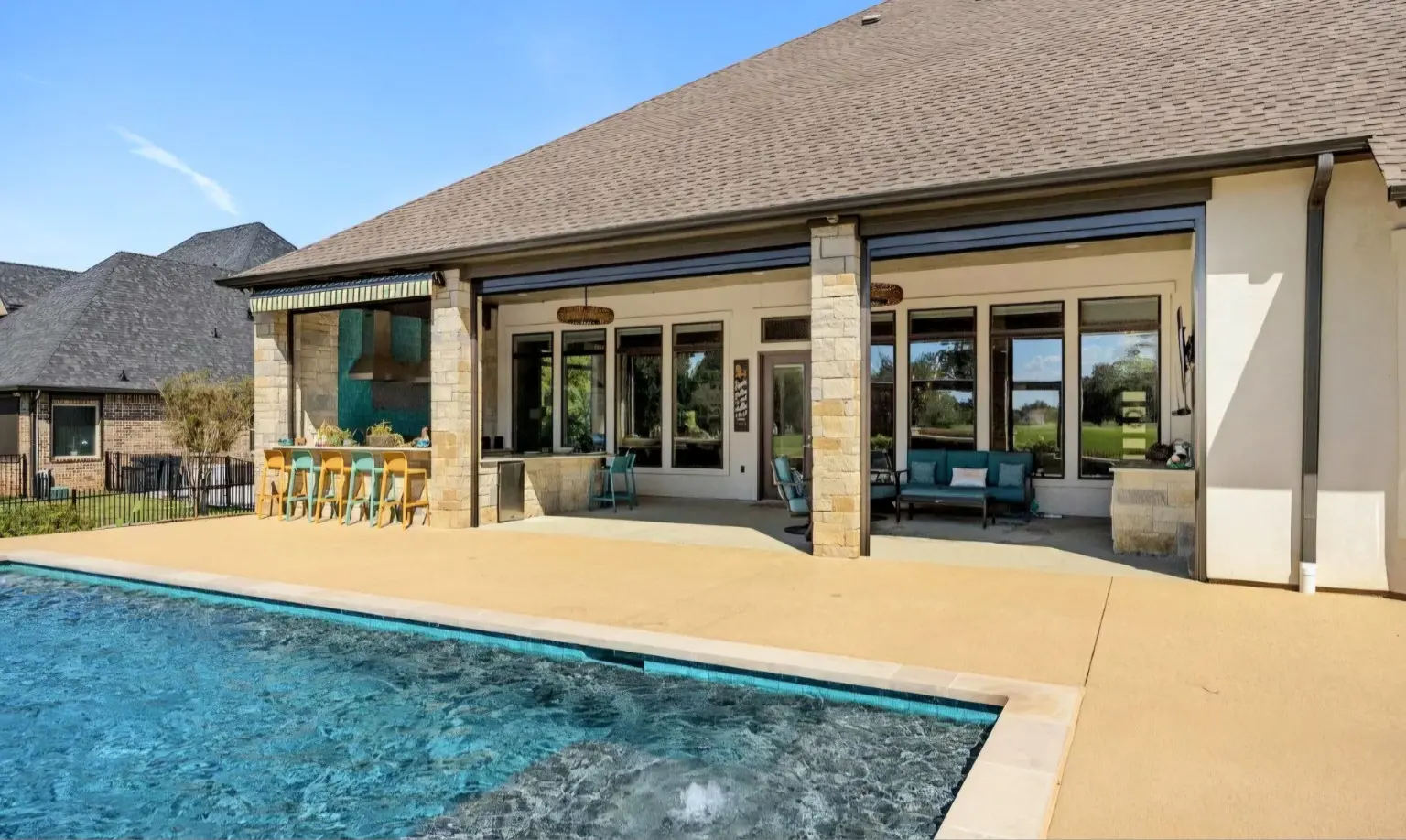 Finished pool, expanded deck, and covered living area