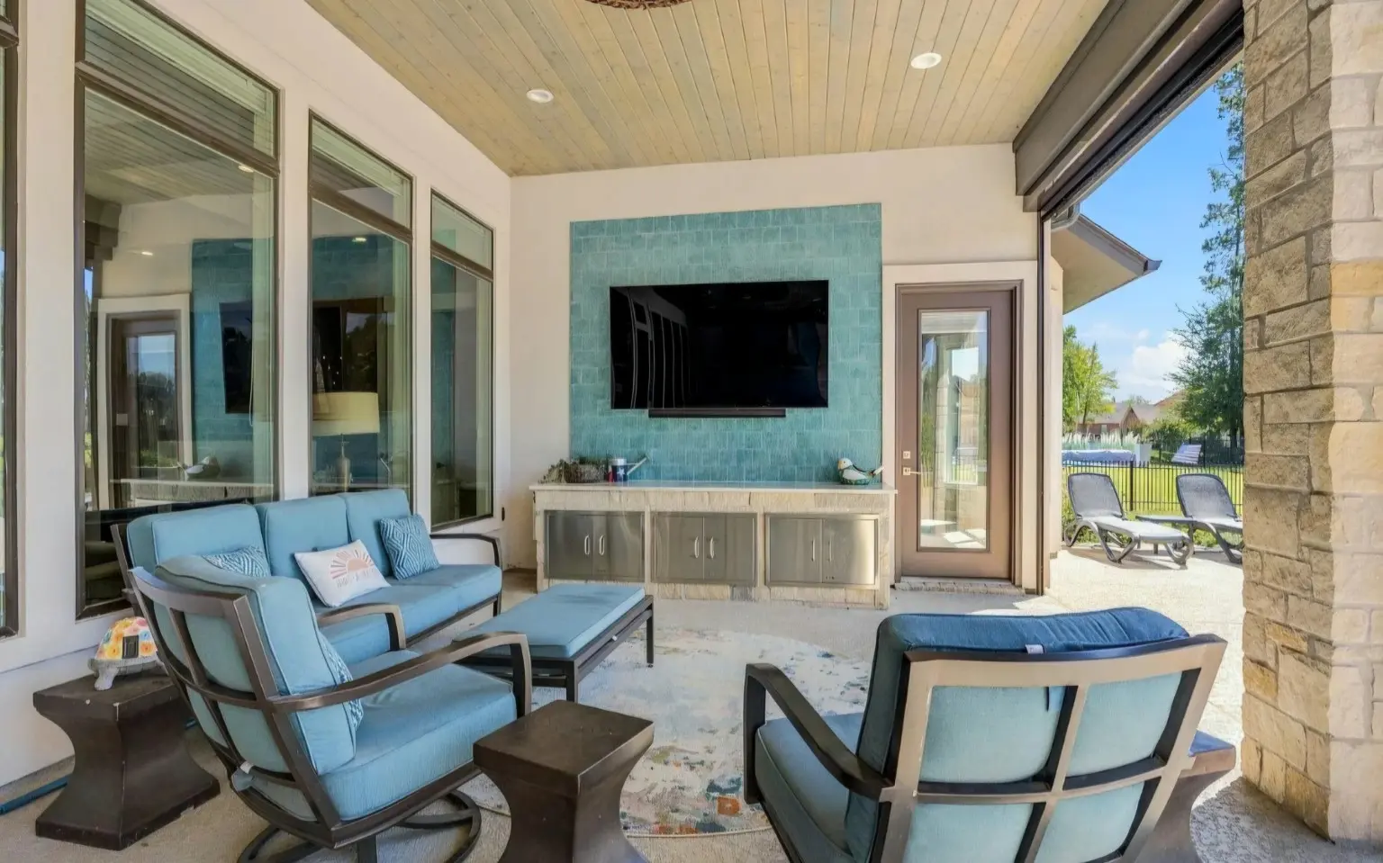 Finished covered seating area and television wall